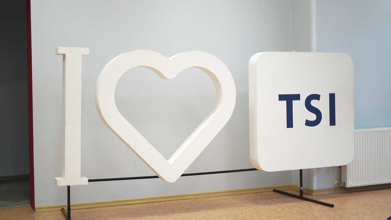 A large white “I ♥ TSI” sign standing in a hall at TSI
